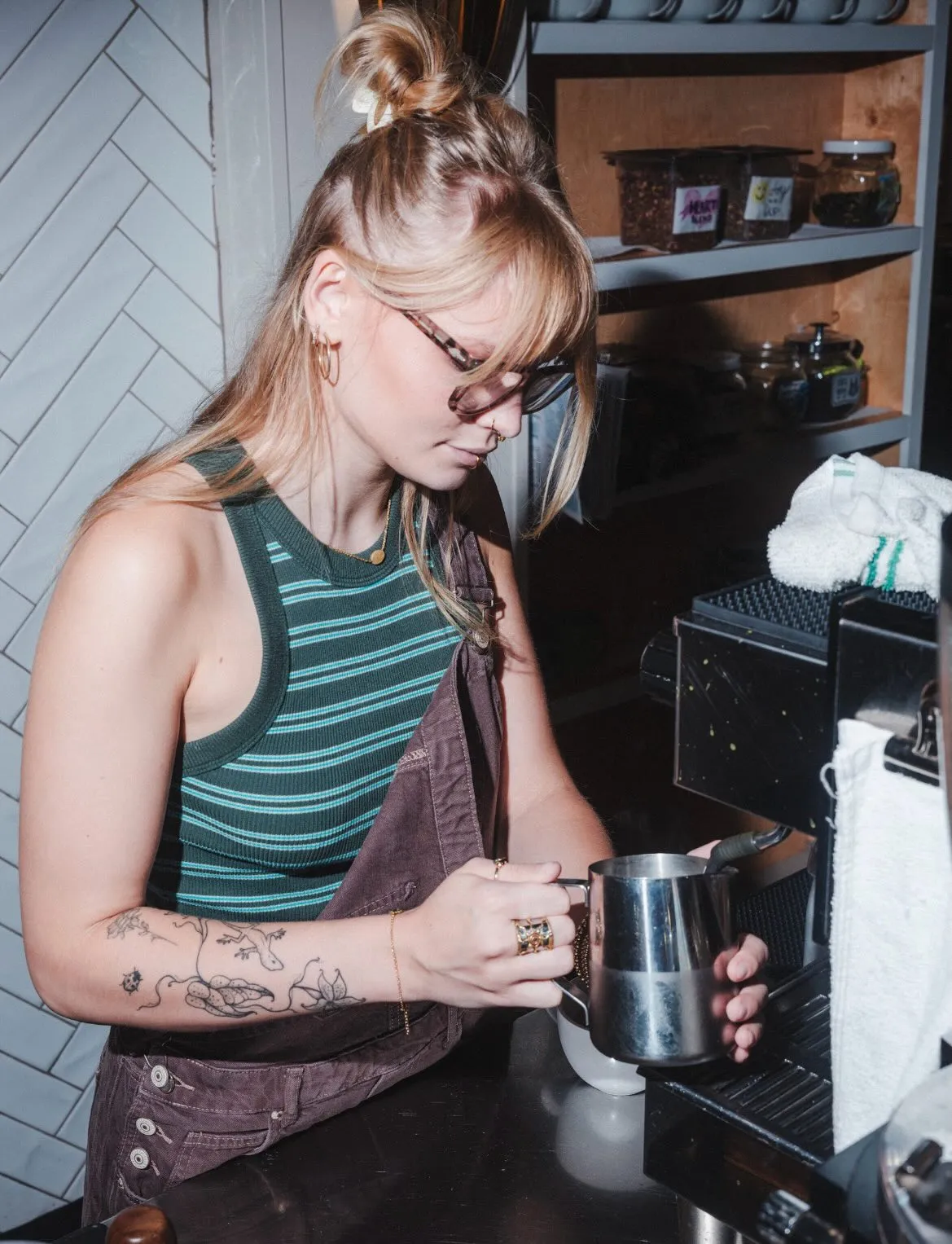 Barista steaming milk at Melanie's Food Fantasy — $2 Tuesday lattes