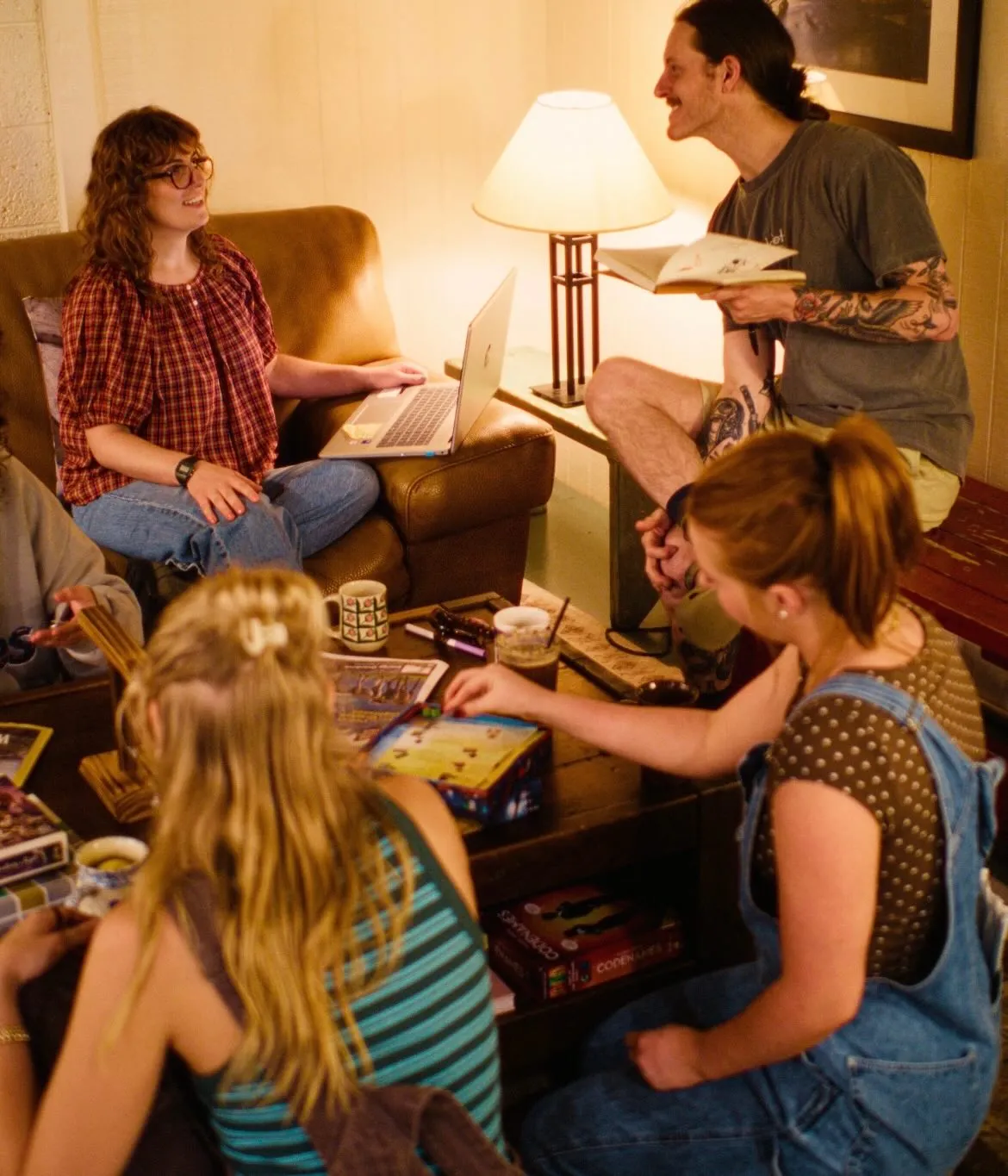 Friends playing board games over coffee at Melanie's Food Fantasy